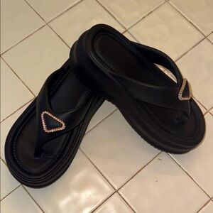 Great sandals black with a 2 inch platform very comfortable size 7